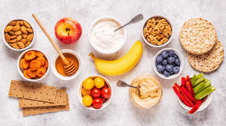Snacking is an essential part of a balanced diet, but not all snacks are created equal. The right snack can curb hunger, stabilize blood sugar, and keep your energy levels high. However, choosing the wrong snacks—like processed foods high in sugar and unhealthy fats—can leave you feeling sluggish and hungrier than before. The key to a satisfying snack is balance. Let’s explore how to build a healthy snack that keeps you full and energized. The Formula for a Satisfying Snack A well-balanced snack should contain three essential components: 1️⃣ Protein – Helps build and repair tissues, promotes fullness, and stabilizes blood sugar. 2️⃣ Fiber – Slows digestion, aids in gut health, and keeps you feeling full longer. 3️⃣ Healthy Fats – Supports brain function, provides sustained energy, and enhances satiety. By combining these three elements, you create a nutrient-dense snack that satisfies hunger and keeps cravings in check. Step 1: Choose a Protein Source Protein is essential for muscle repair, metabolism, and prolonged satiety. Good protein sources for snacks include: ✔ Greek Yogurt – High in protein and probiotics for gut health ✔ Hard-Boiled Eggs – Portable and packed with high-quality protein ✔ Cottage Cheese – A great source of casein protein for slow digestion ✔ Nuts & Seeds – Almonds, walnuts, and chia seeds provide protein and healthy fats ✔ Hummus – A plant-based protein option made from chickpeas ✔ Turkey or Chicken Slices – Lean and protein-rich options for a quick bite Step 2: Add Fiber for Lasting Fullness Fiber helps slow digestion and regulates blood sugar, preventing sudden energy crashes. Some fiber-rich foods to include in your snack are: ✔ Fruits – Apples, berries, pears, and bananas provide natural sweetness and fiber ✔ Vegetables – Carrot sticks, bell peppers, cucumbers, and celery are low-calorie but high in fiber ✔ Whole Grains – Oats, whole-grain crackers, and quinoa help sustain energy ✔ Legumes – Chickpeas, black beans, and lentils add both protein and fiber Step 3: Incorporate Healthy Fats for Energy Healthy fats keep you feeling satisfied for longer and provide essential nutrients for brain health. Some excellent sources include: ✔ Avocado – Rich in heart-healthy monounsaturated fats ✔ Nut Butters – Peanut butter, almond butter, and cashew butter add flavor and satiety ✔ Olive Oil – Drizzle on whole-grain toast or mix with hummus ✔ Chia & Flaxseeds – Provide omega-3 fatty acids for brain and heart health ✔ Dark Chocolate (70% or higher) – Contains antioxidants and healthy fats Snack Combinations for Maximum Satiety Now that we’ve covered the essentials, here are some balanced snack ideas using the protein-fiber-healthy fat formula: 🥜 Apple Slices with Almond Butter – Sweet, crunchy, and packed with fiber and healthy fats 🥚 Hard-Boiled Egg with Whole-Grain Crackers – High in protein and fiber for sustained energy 🥑 Avocado Toast on Whole-Grain Bread – A perfect balance of fiber, healthy fats, and protein 🍨 Greek Yogurt with Berries & Chia Seeds – Creamy, delicious, and packed with protein and antioxidants 🧀 Cheese with Nuts & Grapes – A mix of protein, fats, and natural sweetness 🥕 Hummus with Carrot Sticks & Cucumber – A crunchy, fiber-rich, plant-based snack 🍿 Air-Popped Popcorn with Nutritional Yeast & Olive Oil – A high-fiber, savory snack option Tips for Smart Snacking ✔ Watch Portion Sizes – Even healthy snacks can lead to weight gain if consumed in excess. Stick to single-serving sizes. ✔ Avoid Processed Snacks – Many packaged snacks contain artificial ingredients, added sugars, and unhealthy fats. Opt for whole foods instead. ✔ Stay Hydrated – Sometimes, we mistake thirst for hunger. Drink water before reaching for a snack. ✔ Plan Ahead – Prepare snacks in advance to avoid unhealthy impulse choices. Conclusion Snacking doesn’t have to derail your health goals. By following the simple formula of protein, fiber, and healthy fats, you can build a snack that keeps you full, energized, and satisfied. Whether you’re craving something sweet or savory, there are countless nutrient-rich snack options that taste great and support your overall well-being. Next time hunger strikes, reach for a balanced snack that nourishes your body and keeps cravings at bay!